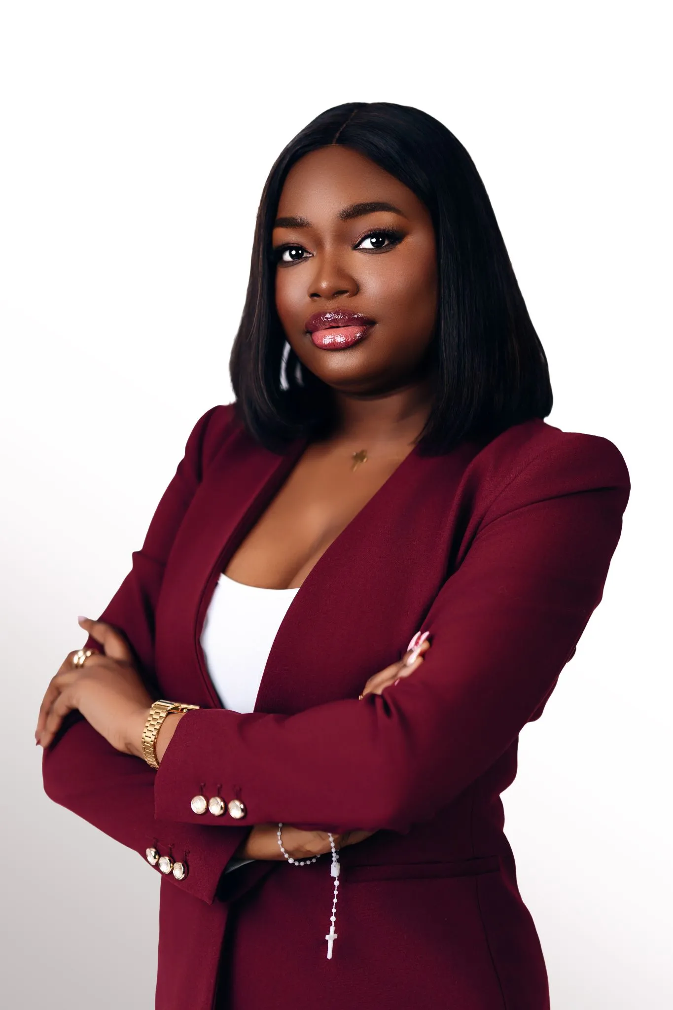 Business professional portrait of a confident woman in a burgundy suit