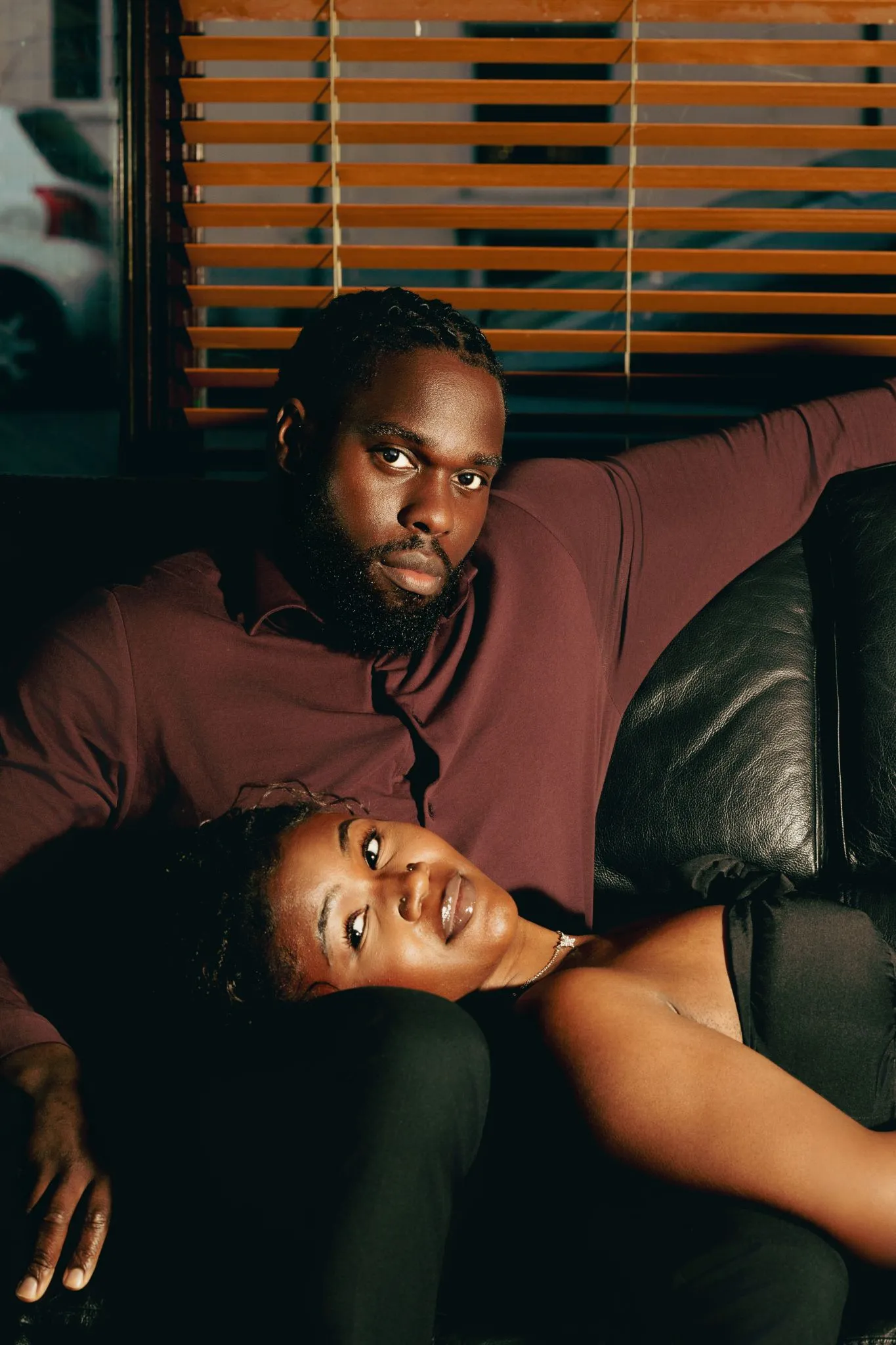 Couple relaxing on a sofa in a cozy setting