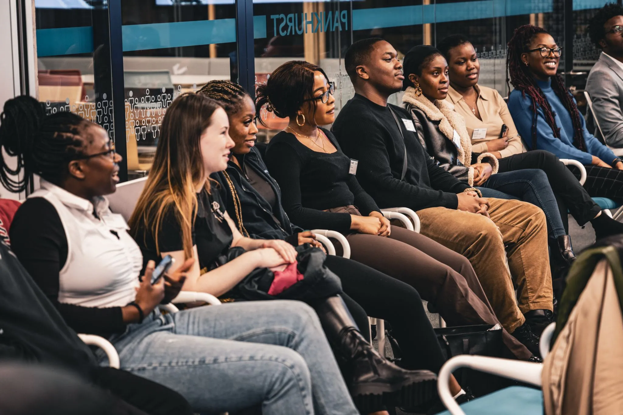 Diverse group engaged in a lively discussion at Eagle event.