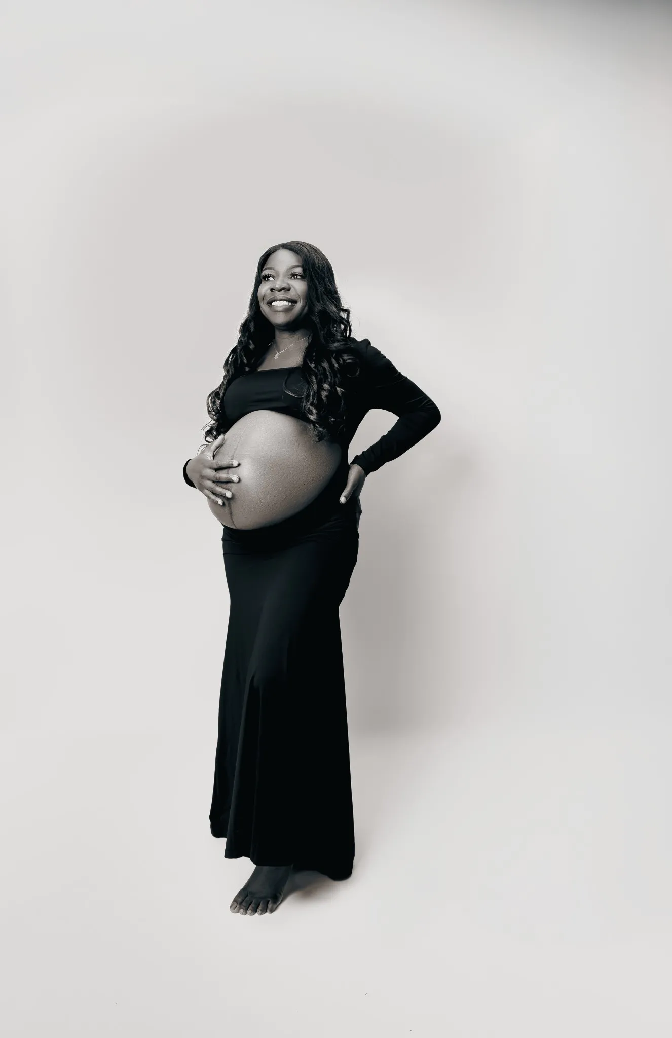 Eagle Productions Maternity Woman Black Dress White Background