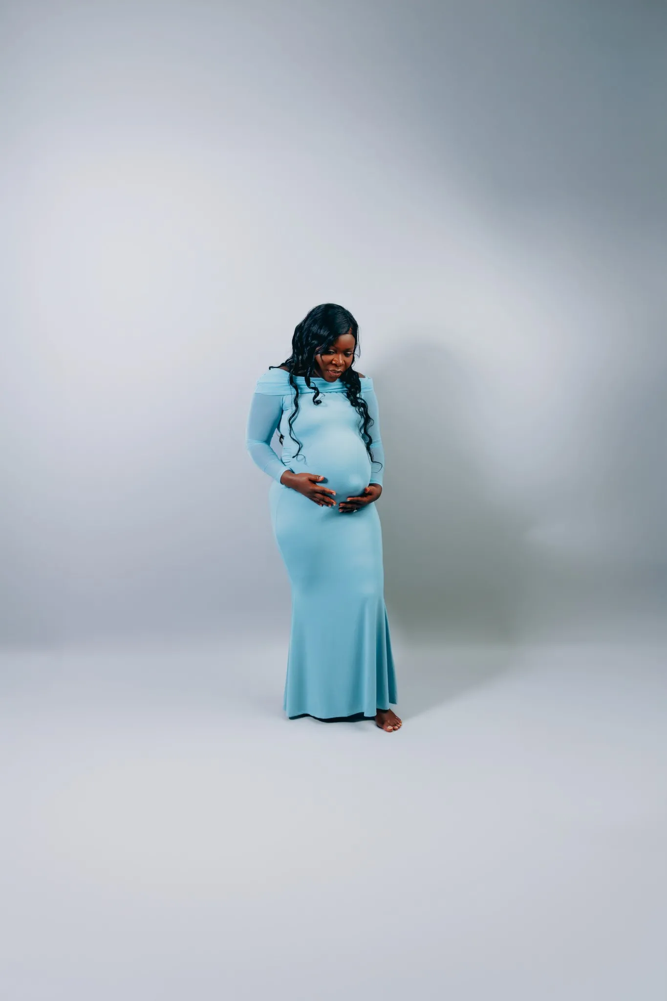 Eagle Productions Maternity Woman Blue Gown White Background