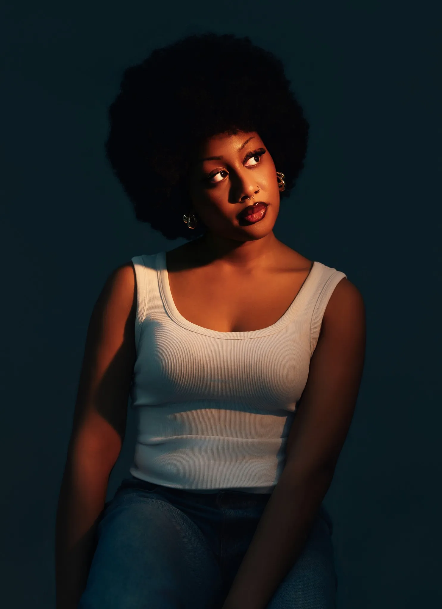 Eagle Productions Portraits Woman Afro White Top Blue Background