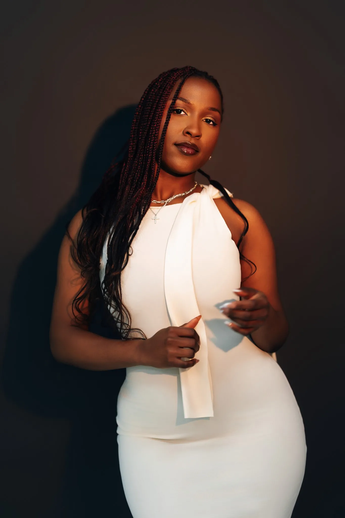 Eagle Productions Portraits Woman White Skirt Dark Background