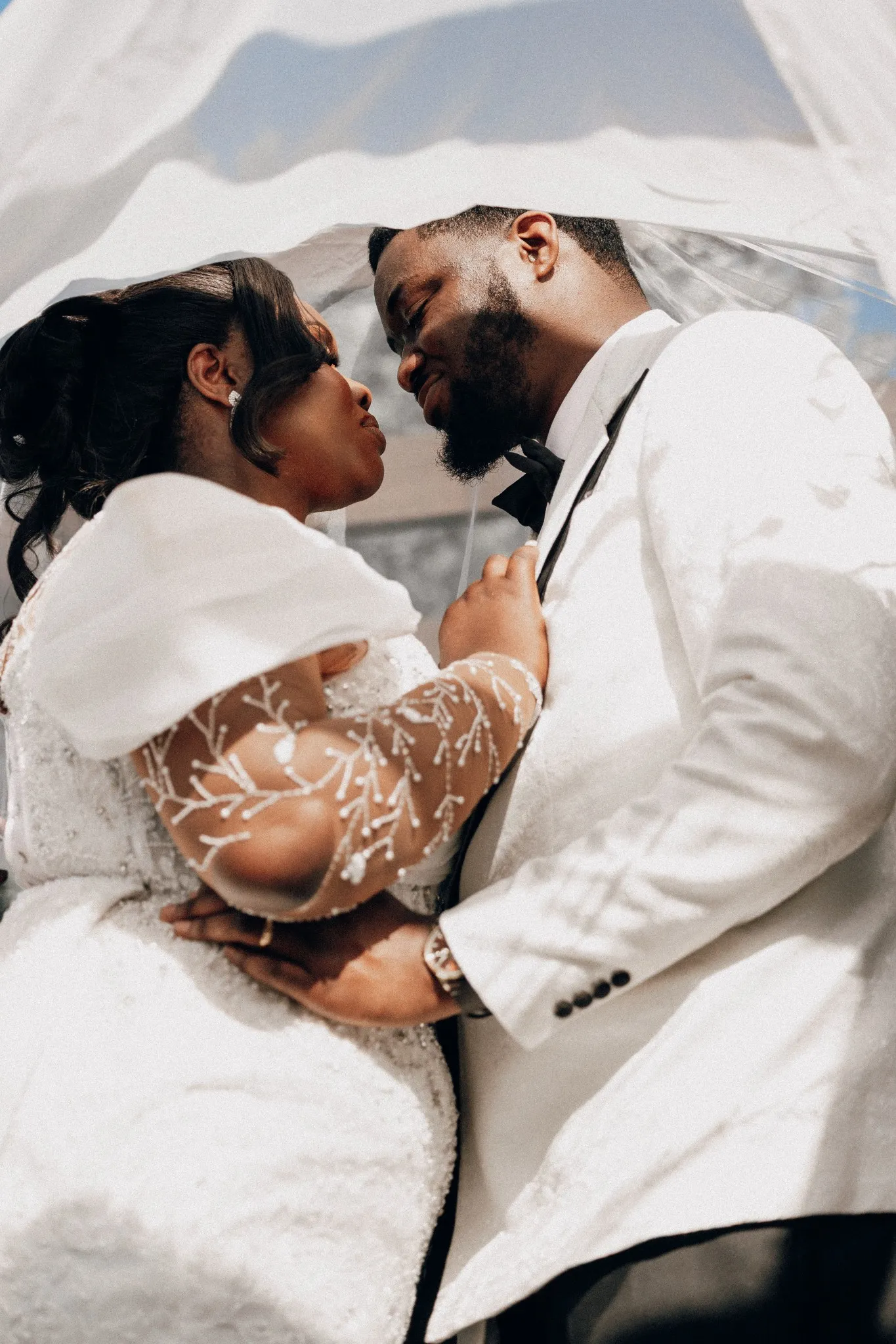 Eagle Productions Weddings Engagements Couple Kiss White Suit Veil