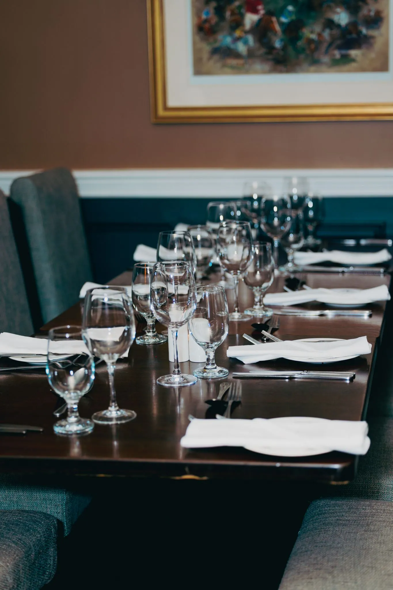 Elegant dining table set with glassware and menus at Eagle restaurant
