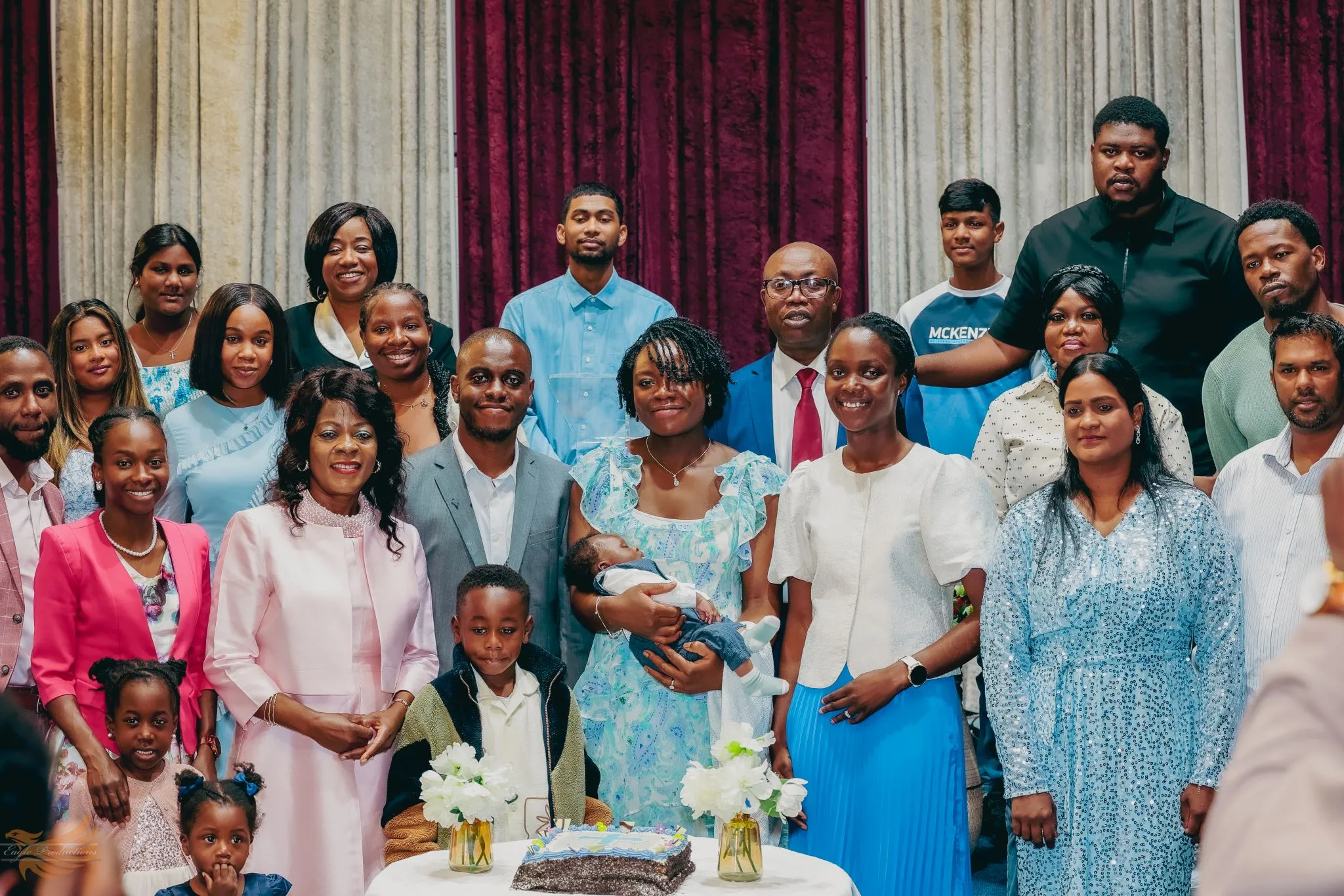 Family gathering celebration with diverse group posing together.