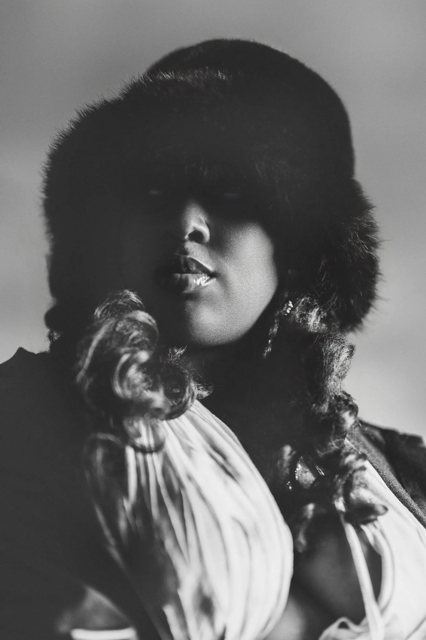Stylish winter portrait of a woman in a fur hat
