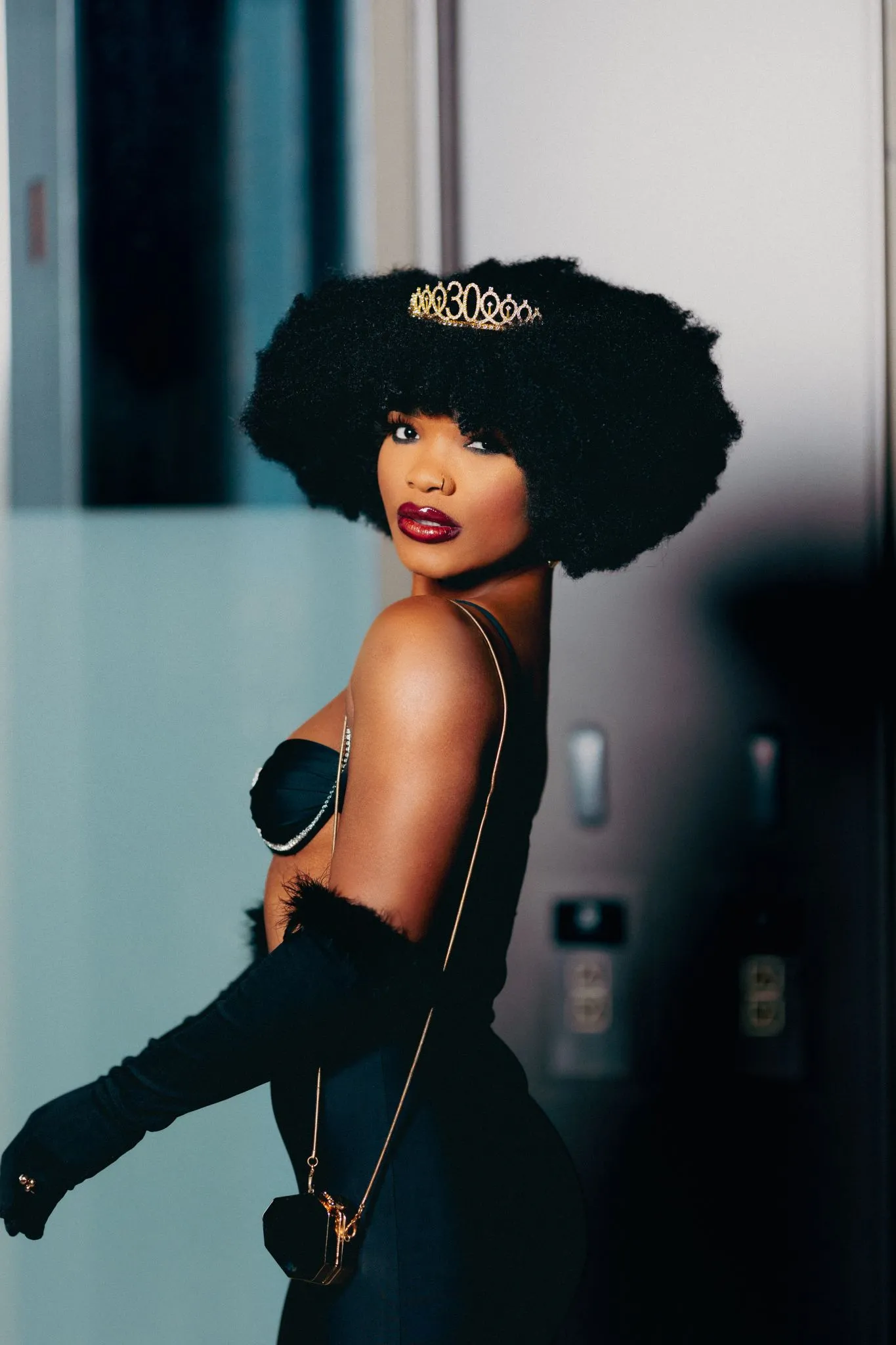 Glamorous woman in elegant evening attire with a tiara