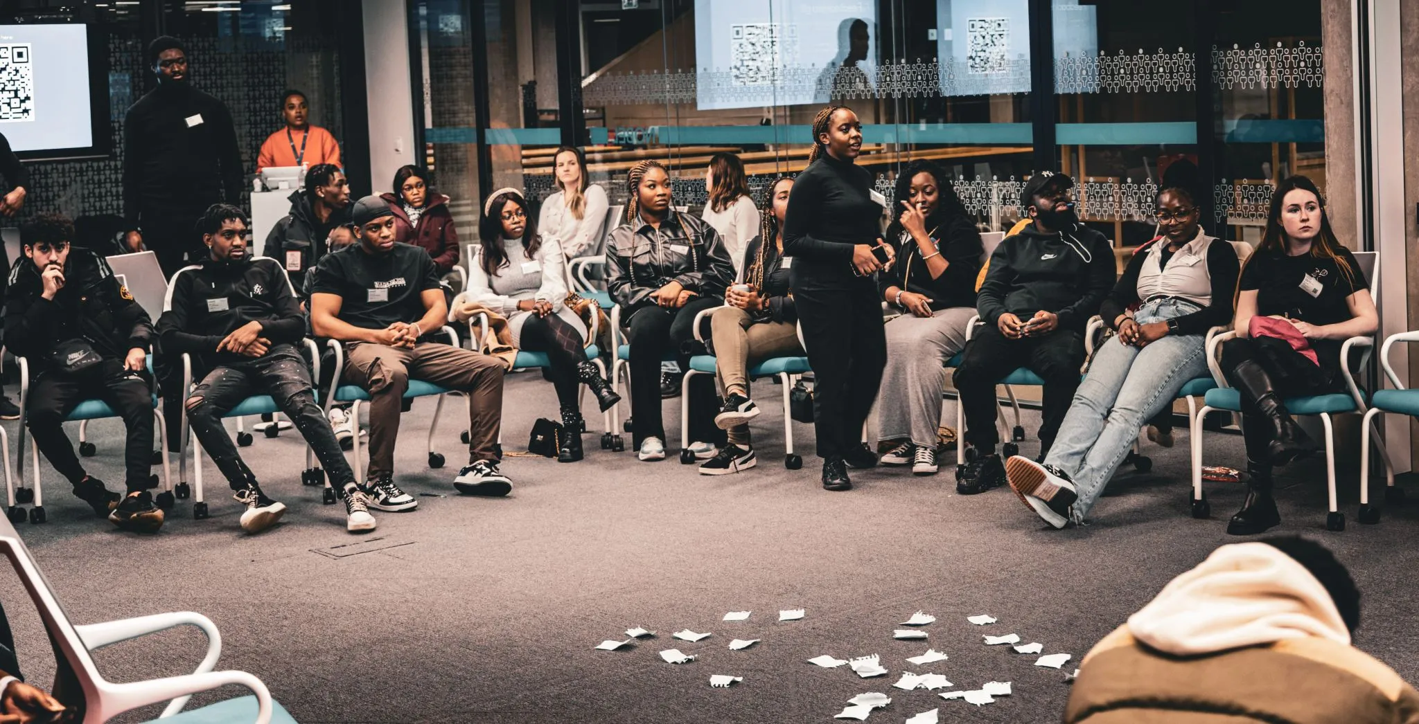 Diverse group engaged in a lively discussion at Eagle event.