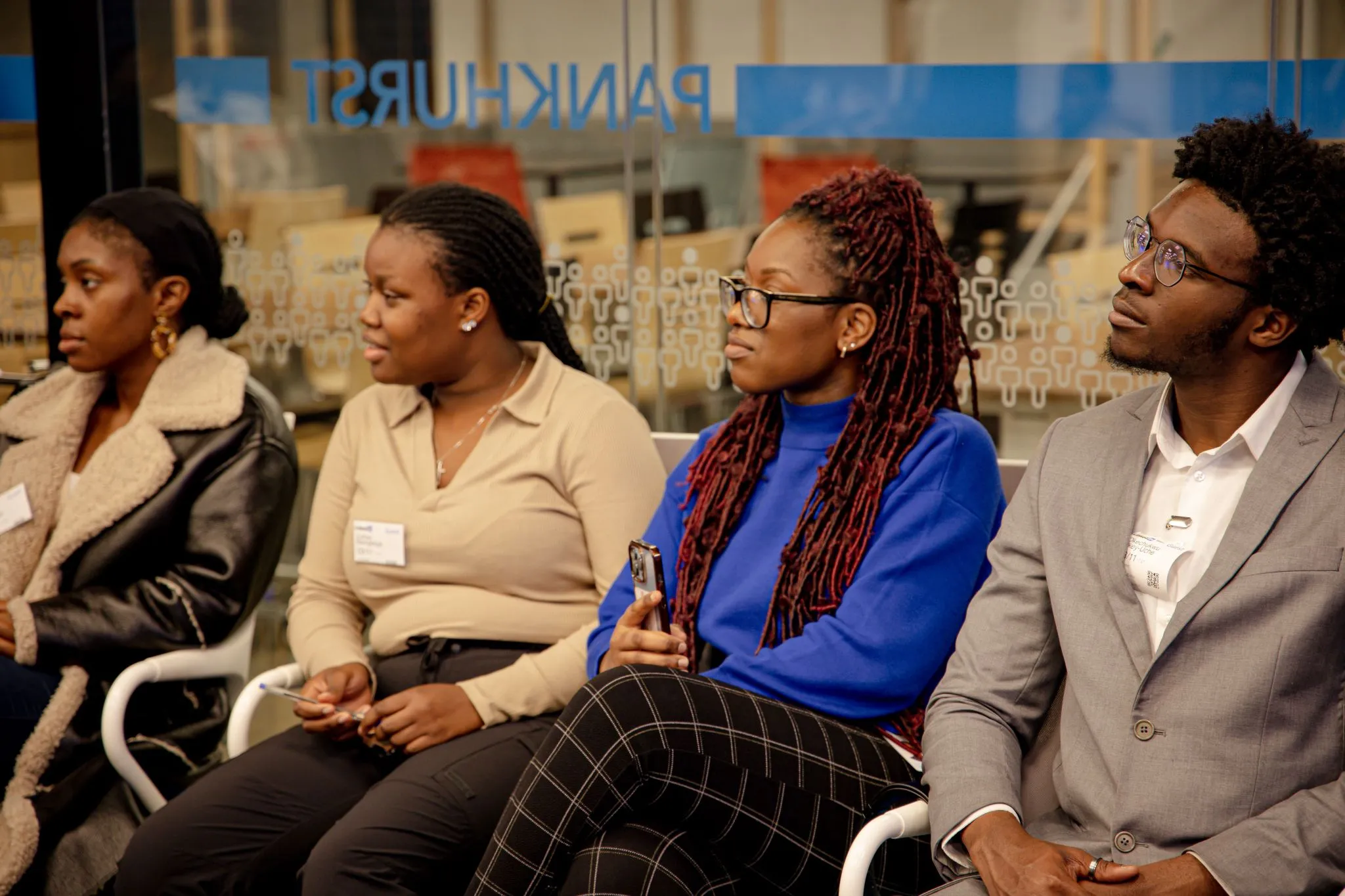 Networking event attendees engaged in a discussion at Eagle.