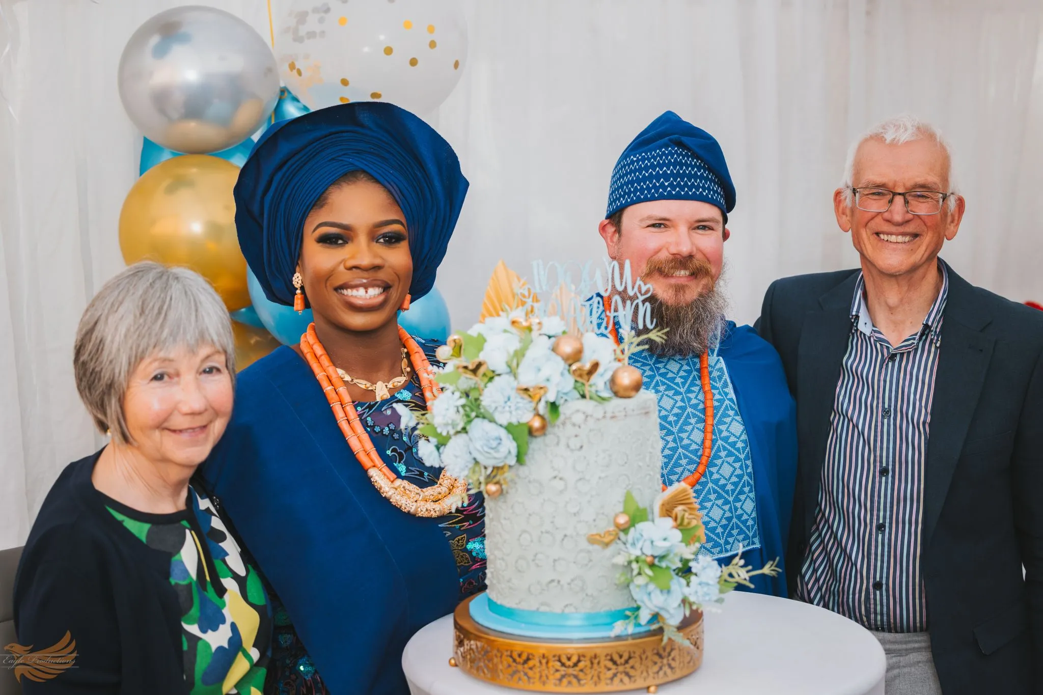 Nigerian wedding celebration with traditional attire and cake