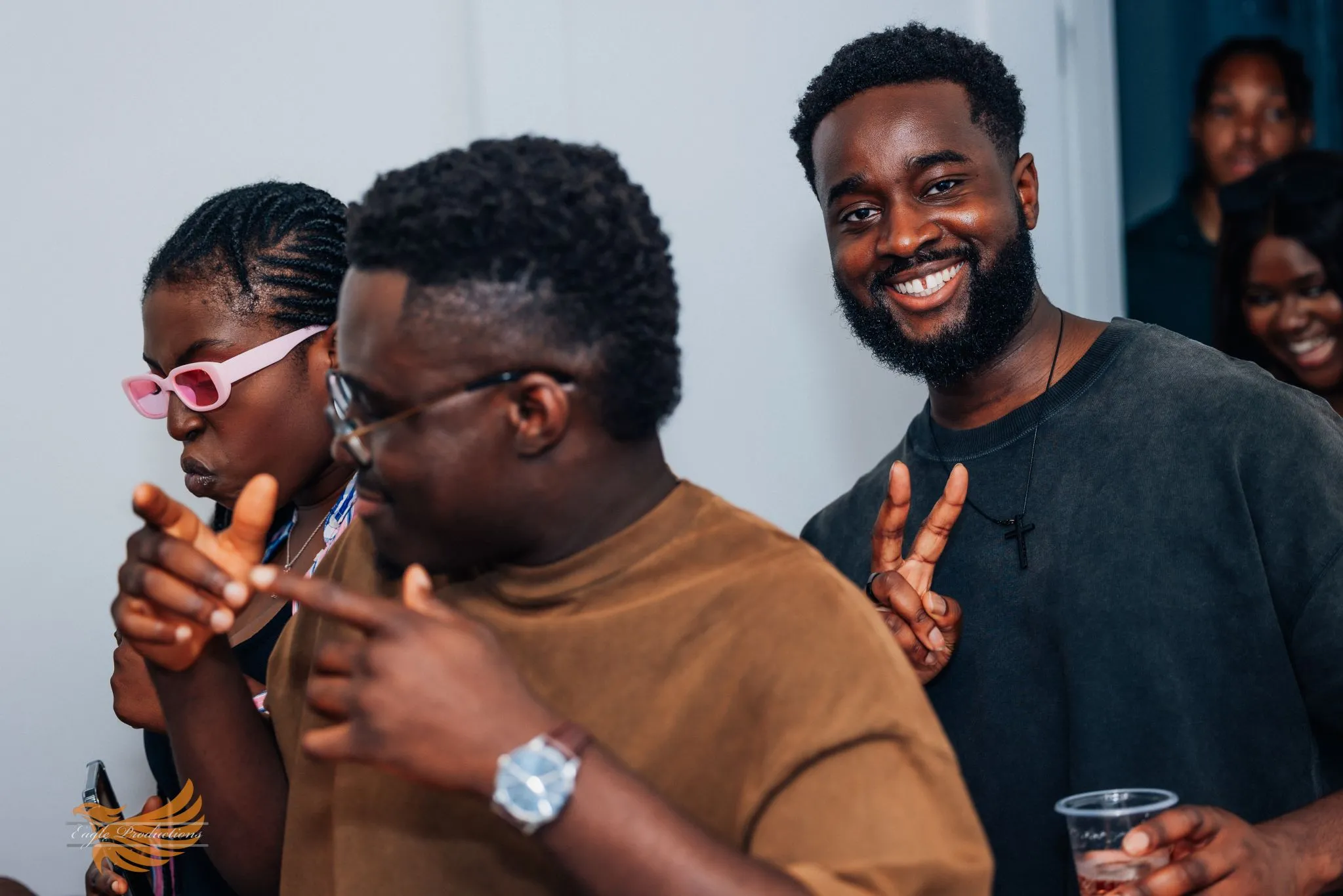 Group of friends celebrating at a party, smiling and having fun