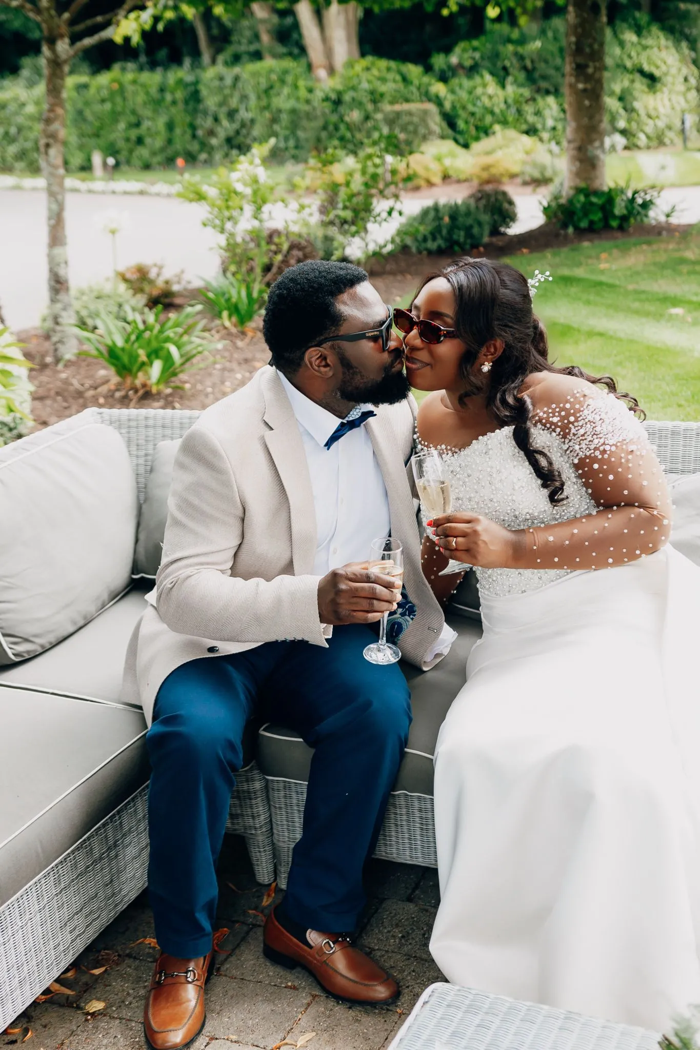 Wedding couple celebrating with champagne outdoors