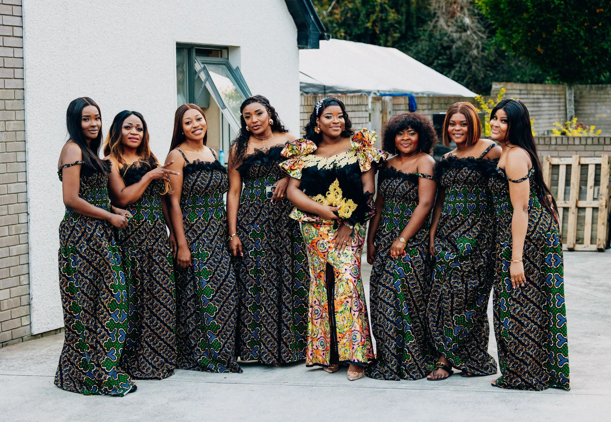 Elegant wedding party dresses with vibrant patterns and diverse styles.